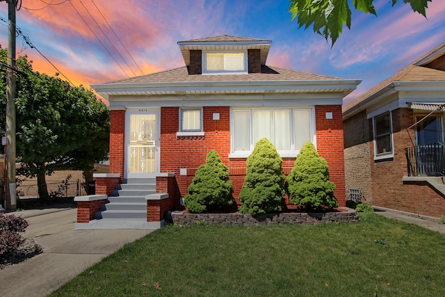 view of front of home with a lawn