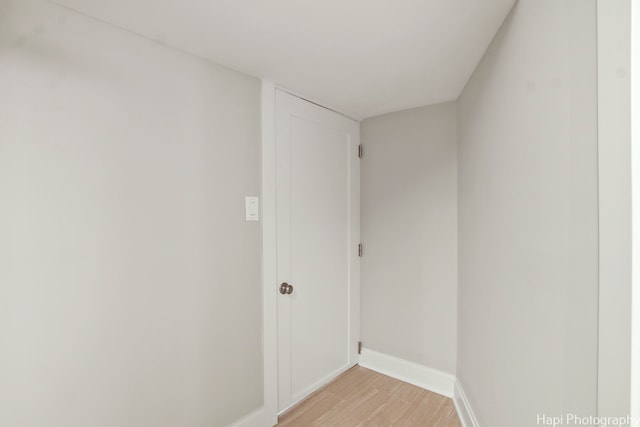 laundry room featuring light hardwood / wood-style floors