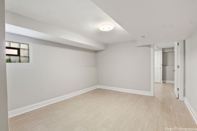 basement featuring light hardwood / wood-style flooring