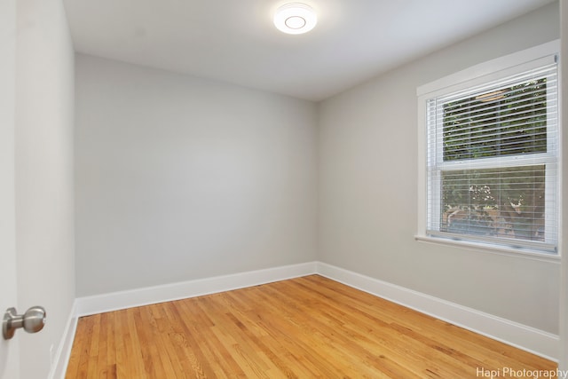 empty room with light hardwood / wood-style floors