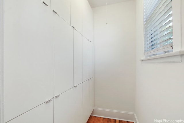 walk in closet featuring hardwood / wood-style flooring