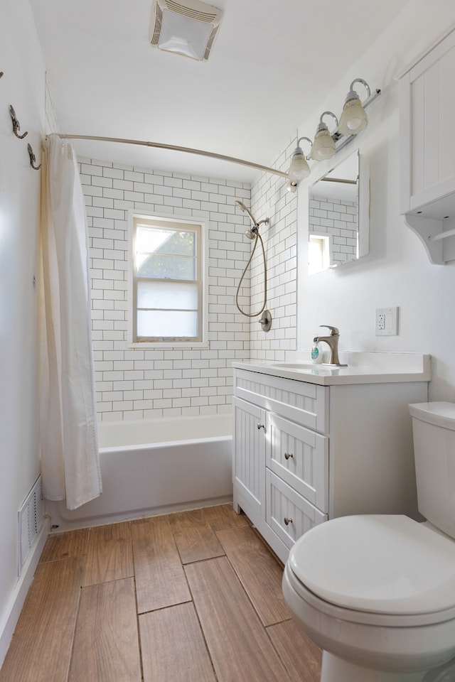 full bathroom featuring vanity, toilet, and shower / bathtub combination with curtain