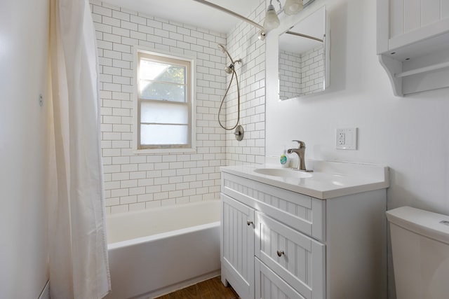 full bathroom featuring toilet, hardwood / wood-style flooring, vanity, and shower / bath combination with curtain