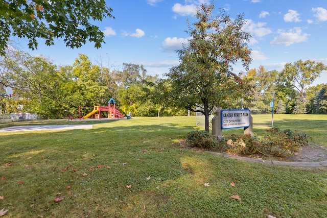 view of community with a yard and a playground