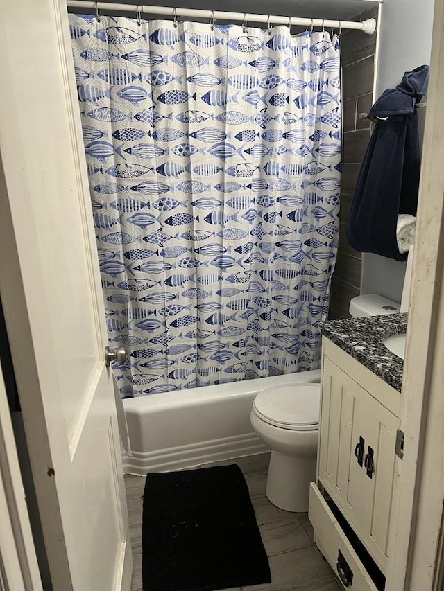 full bathroom with vanity, toilet, and shower / bath combo with shower curtain