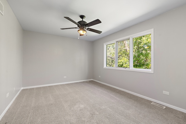 carpeted empty room with ceiling fan