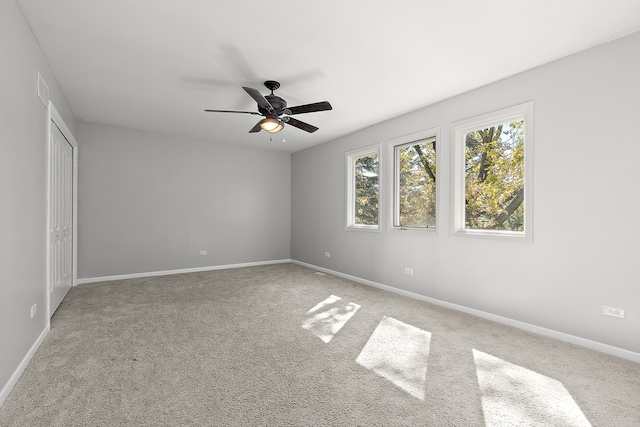 unfurnished bedroom with carpet floors and ceiling fan