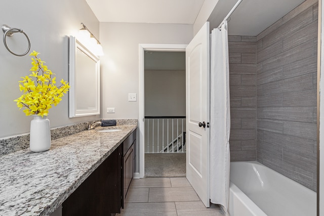 bathroom with shower / bath combo and vanity