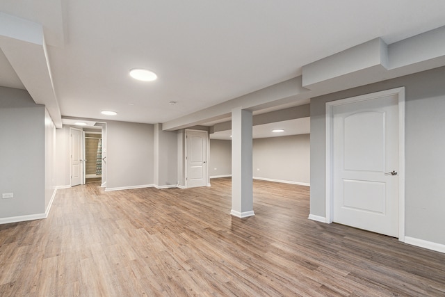 basement featuring hardwood / wood-style flooring