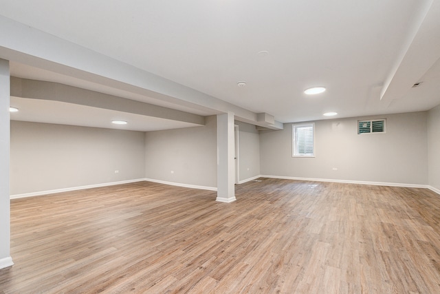 basement featuring light wood-type flooring