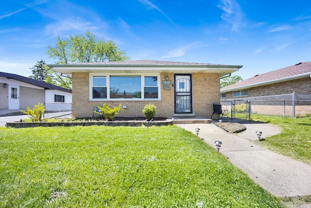 bungalow-style home featuring a front yard