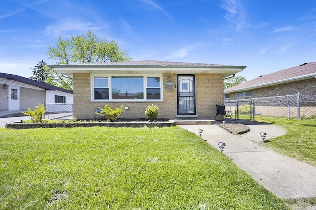 bungalow-style home featuring a front yard