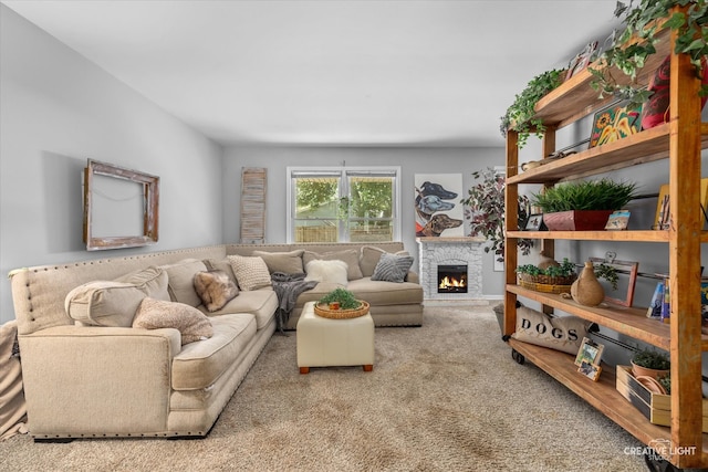 living room featuring light carpet and a fireplace