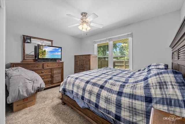 bedroom featuring light carpet and ceiling fan