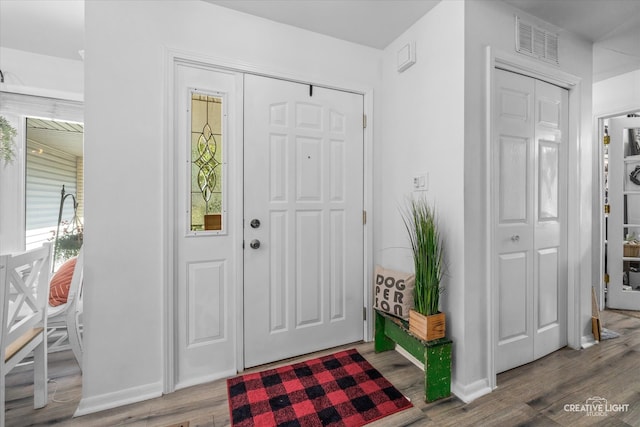 foyer entrance featuring hardwood / wood-style floors