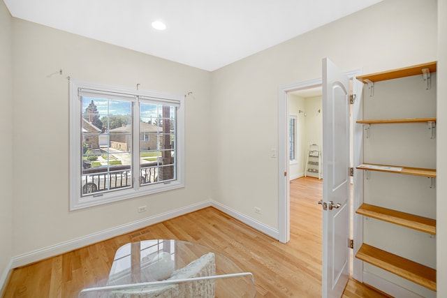 unfurnished bedroom with light wood-type flooring