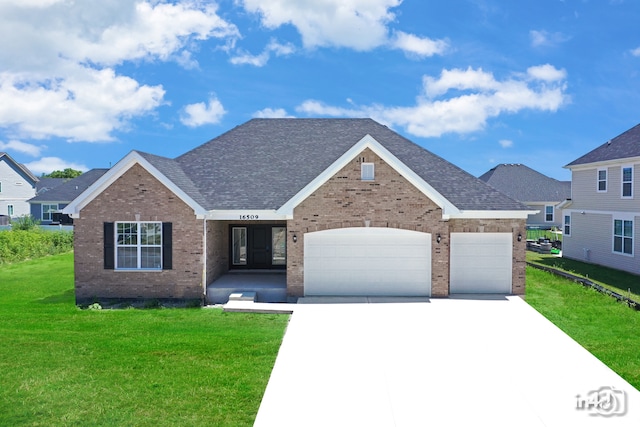 view of front of property with a garage and a front yard