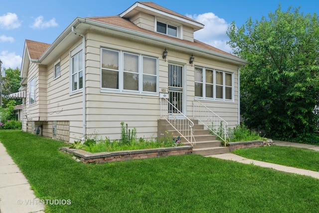 bungalow with a front lawn