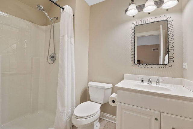 bathroom featuring tile patterned flooring, vanity, a shower with curtain, and toilet