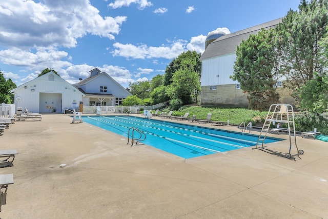 view of swimming pool with a patio