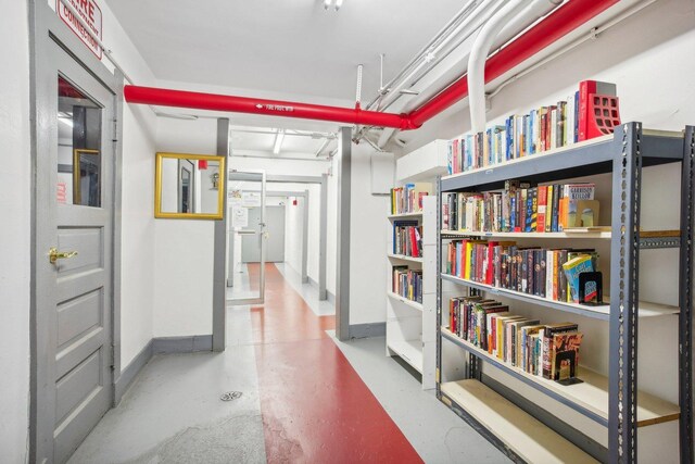 hallway with concrete flooring