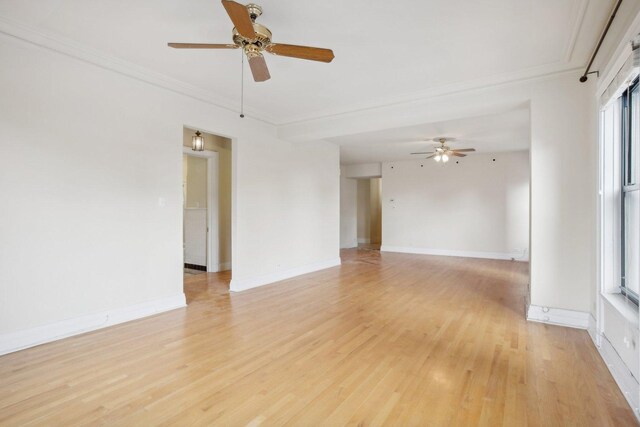 unfurnished room with crown molding, light hardwood / wood-style flooring, and ceiling fan