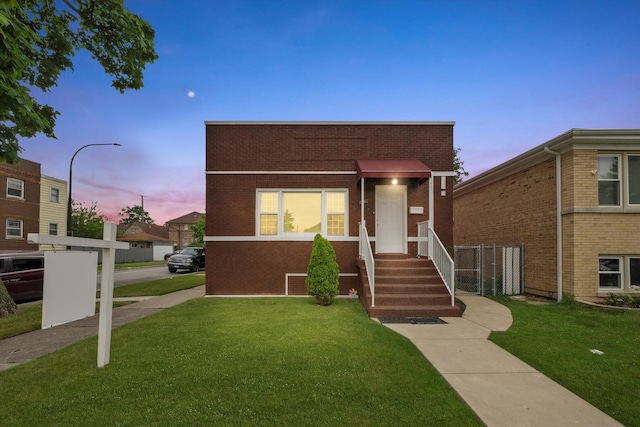 view of front of house with a lawn