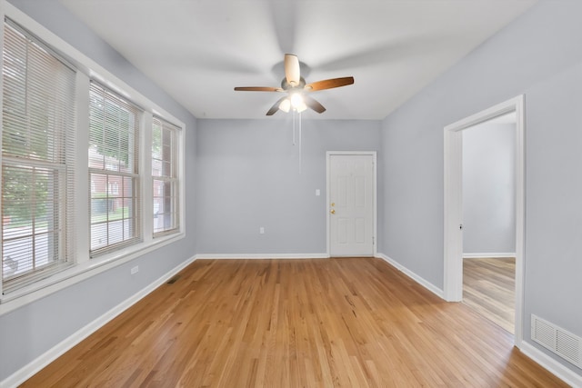 unfurnished room with light hardwood / wood-style flooring and ceiling fan