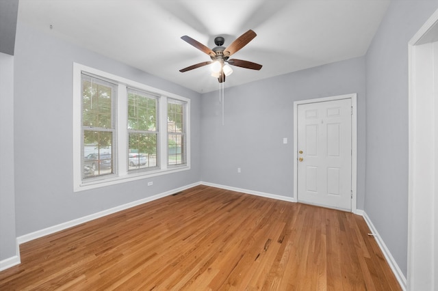 unfurnished room featuring light hardwood / wood-style flooring and ceiling fan