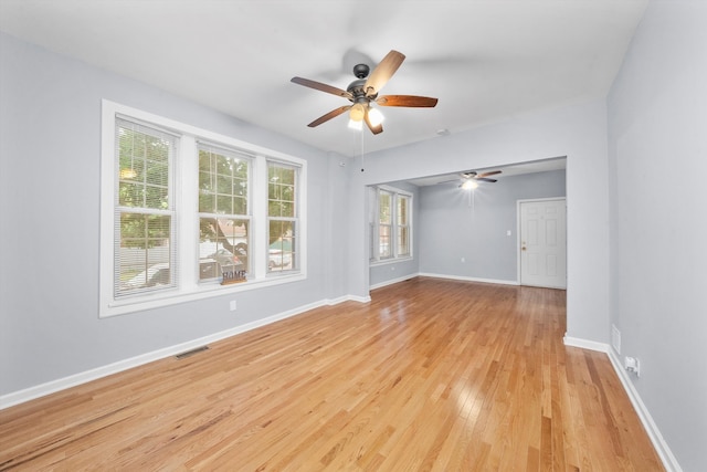 spare room with ceiling fan and light hardwood / wood-style floors