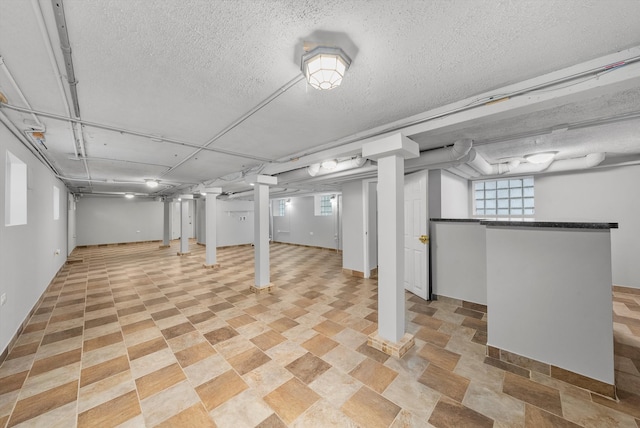 basement featuring light tile patterned floors