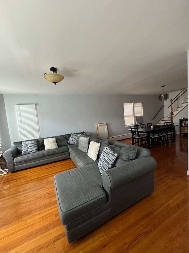 living room featuring a notable chandelier and hardwood / wood-style floors