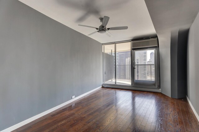 living room featuring dark hardwood / wood-style floors and a baseboard radiator