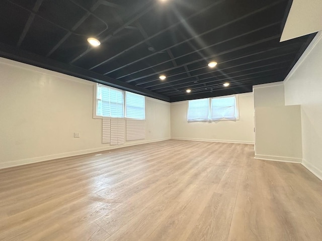 basement featuring light hardwood / wood-style floors