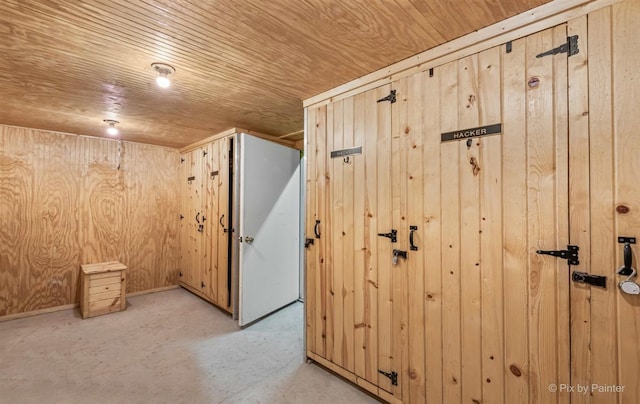 interior space featuring wood walls and wooden ceiling