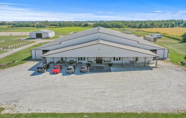 birds eye view of property featuring a rural view