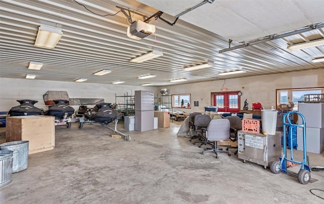 garage with french doors and a garage door opener