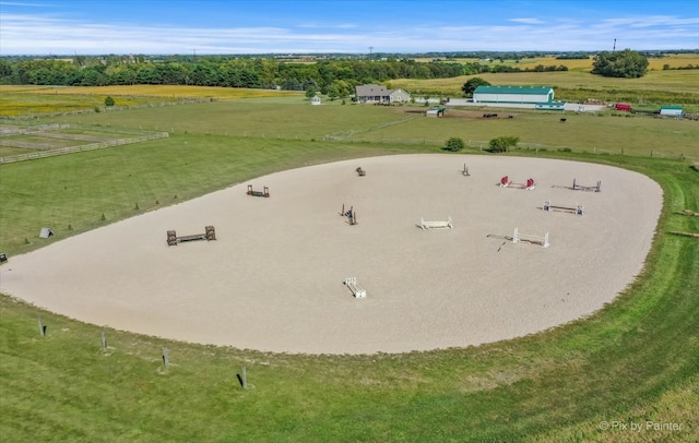 birds eye view of property with a rural view