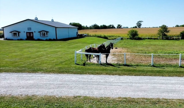 view of yard featuring a rural view and fence