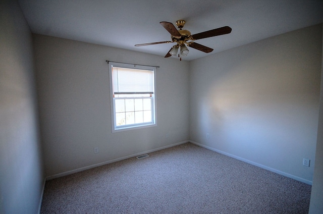 unfurnished room featuring carpet and ceiling fan