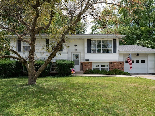 view of front of property with a garage and a front yard