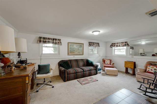 living room featuring ornamental molding, brick wall, and carpet floors