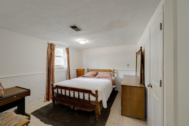 bedroom featuring a textured ceiling