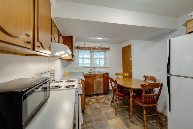 kitchen with white appliances and sink