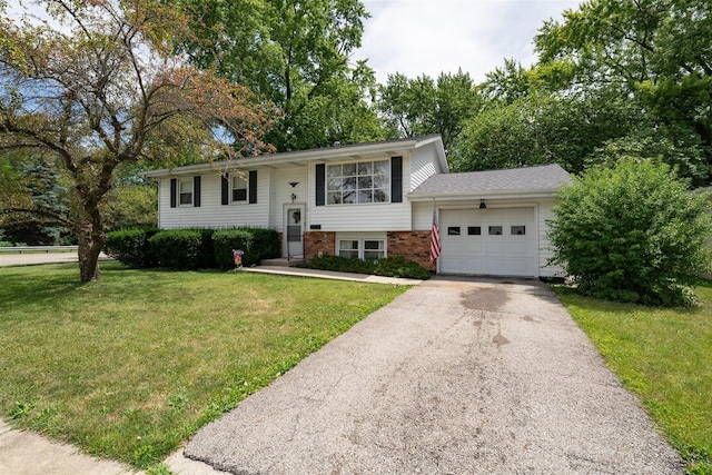 split foyer home with a garage and a front yard