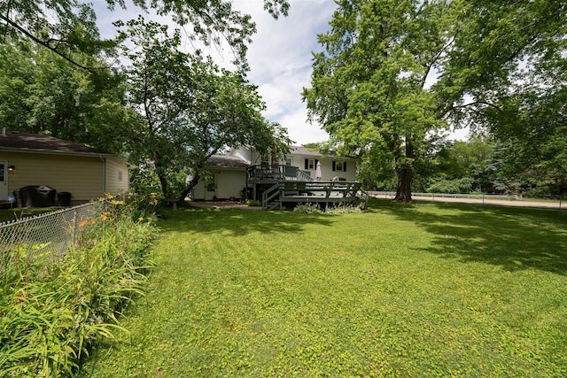 view of yard featuring a wooden deck