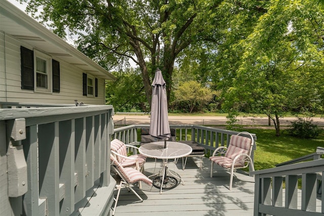 wooden deck with a yard