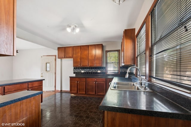 kitchen with tasteful backsplash and sink