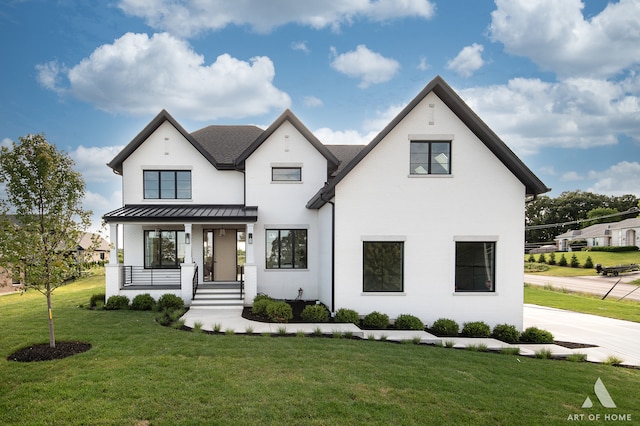 view of front of house featuring a porch and a front yard