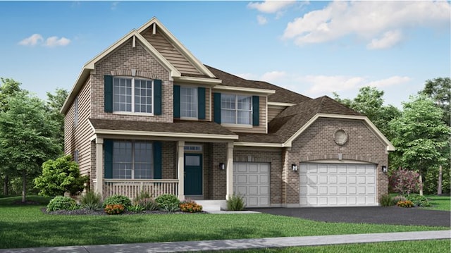 view of front of property with a garage and a front yard